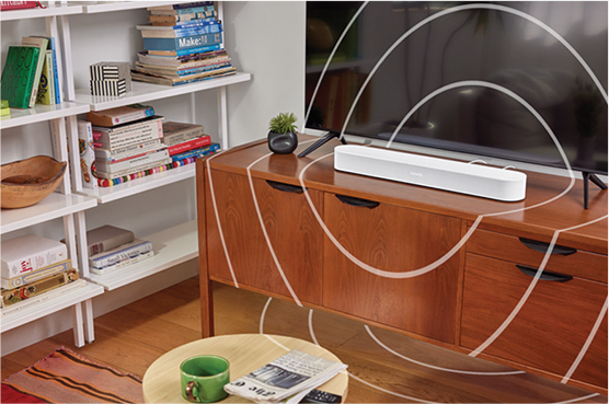 A photo of a living room, a soundbar has waves of sound coming out of it