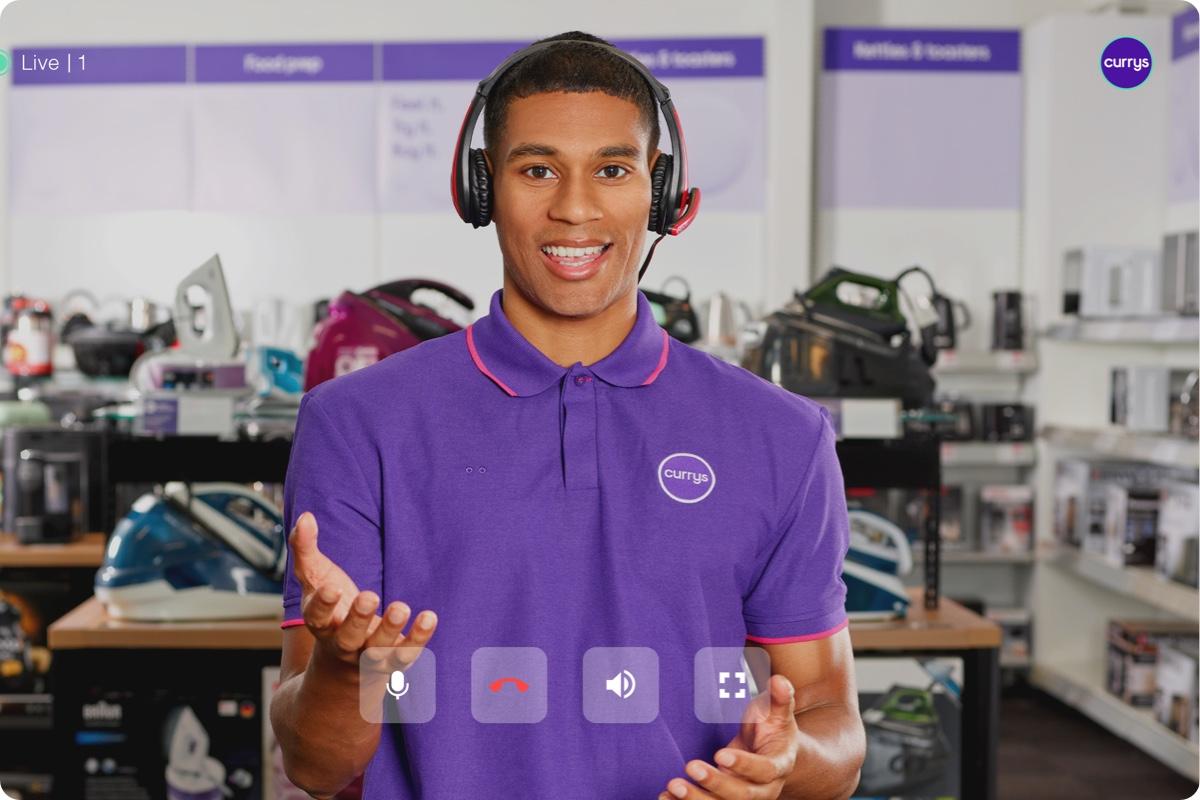 Currys expert with headset looking at camera with headset