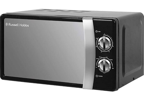 a black microwave oven with silver buttons on a white background