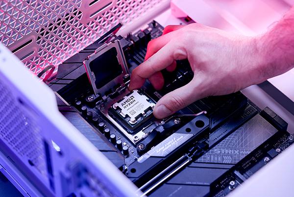 a person is working on a computer motherboard in a computer case
