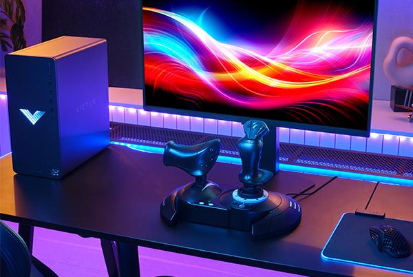a close up of a joystick and throttle on a table