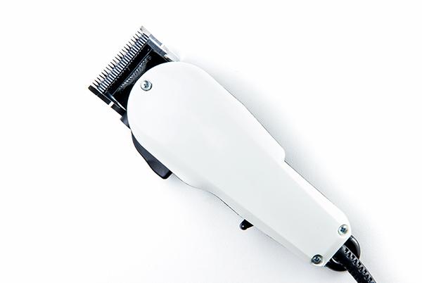 a white hair clipper with a cord attached to it