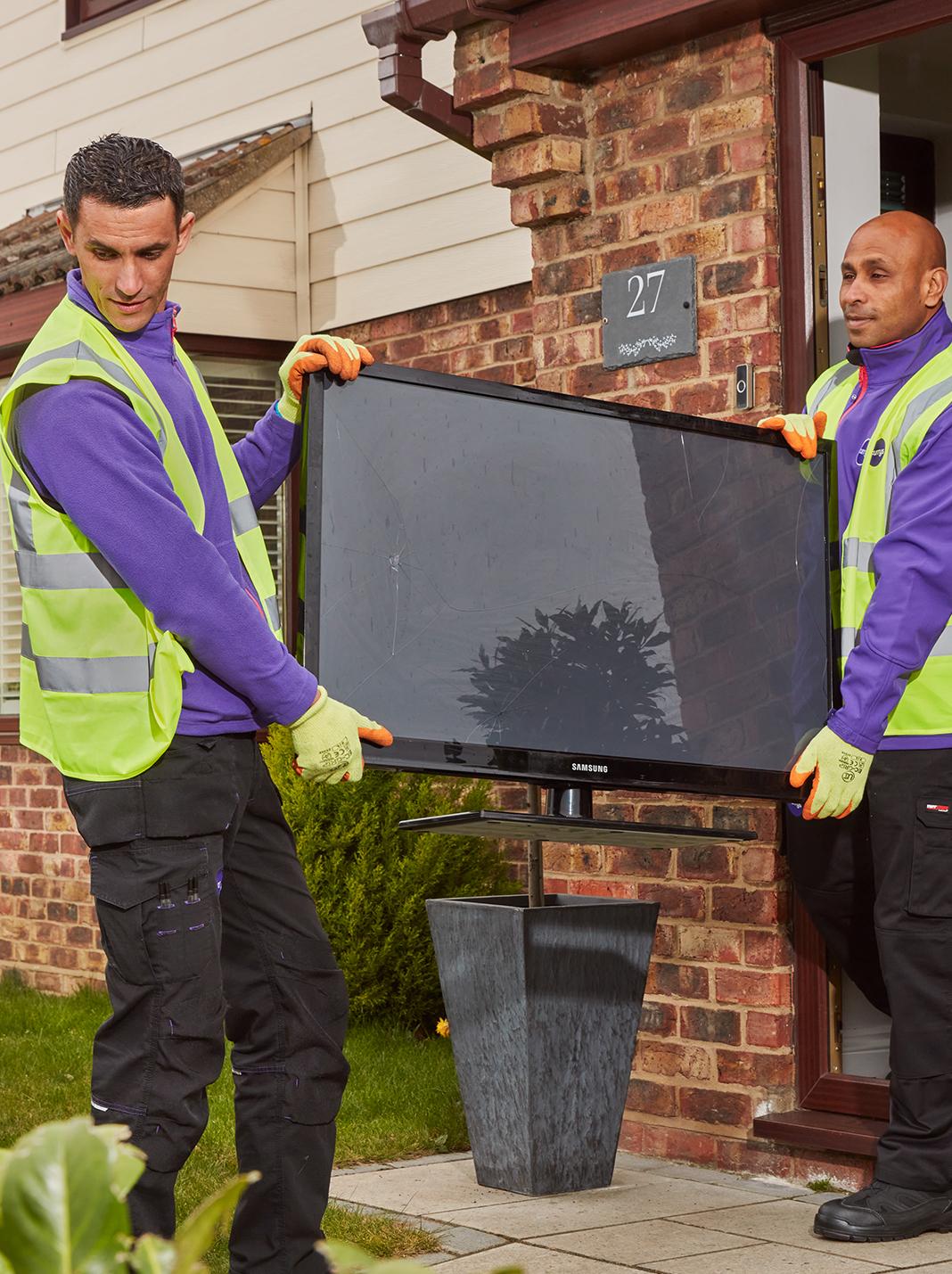 Colleagues remove old TV