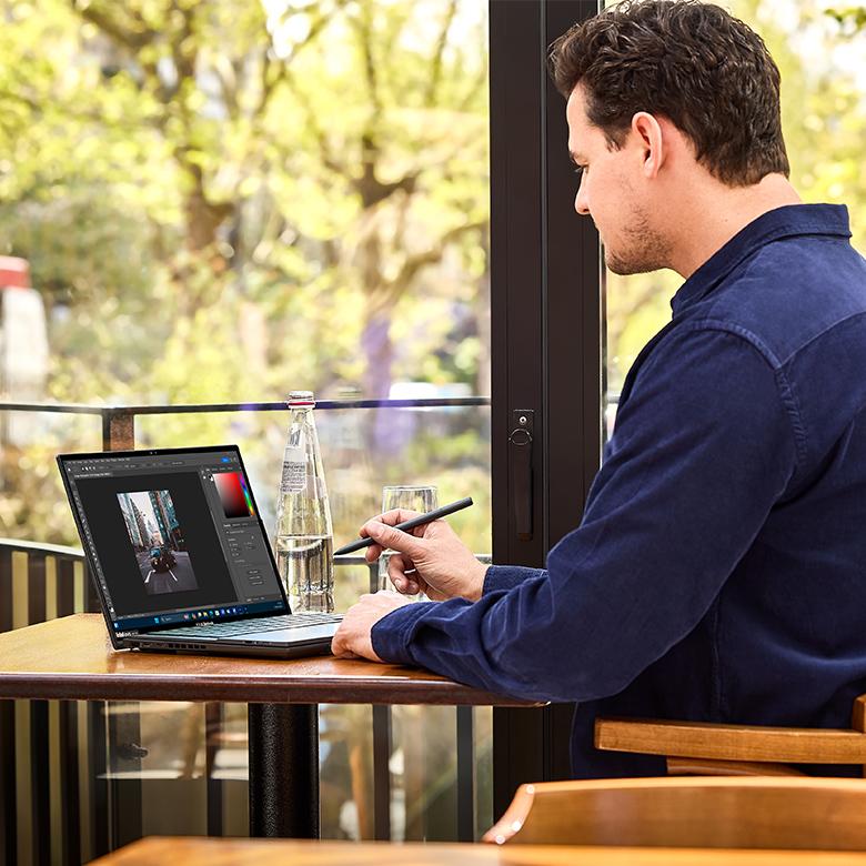 Man drawing on his ASUS Zenbook Duo