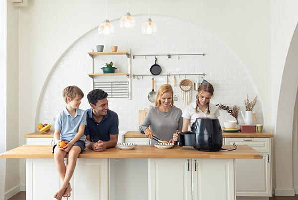 Family using an air fryer