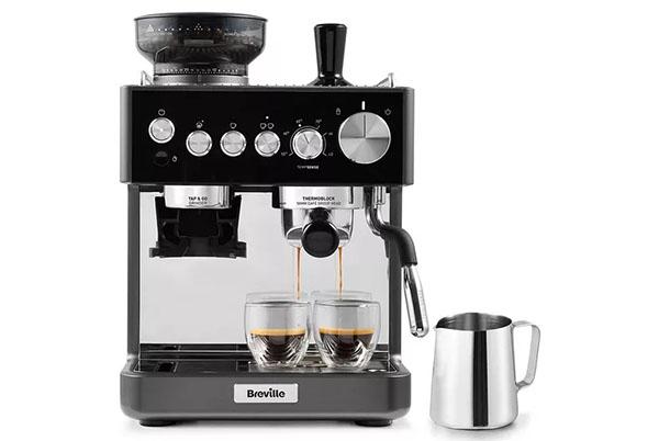 a black coffee machine with two cups and a milk frother
