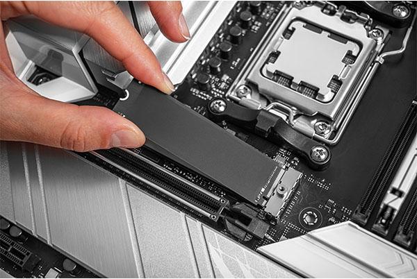 a person is removing the motherboard from a computer