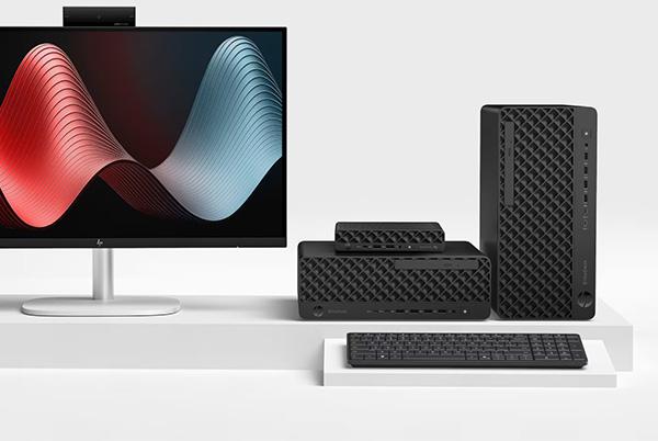 a computer monitor, keyboard, and mouse on a white shelf