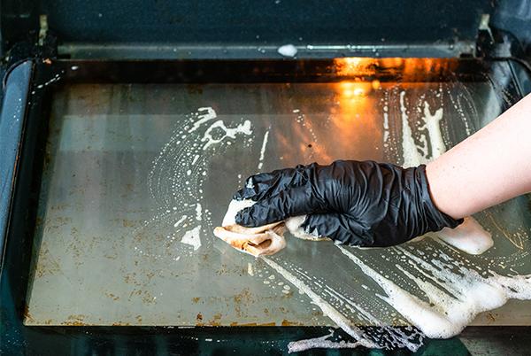 Cleaning front of oven