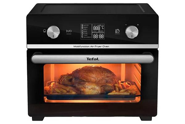 a turkey is cooking in a toaster oven with a timer