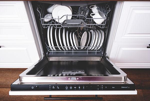 a dishwasher with a full load of dishes in it