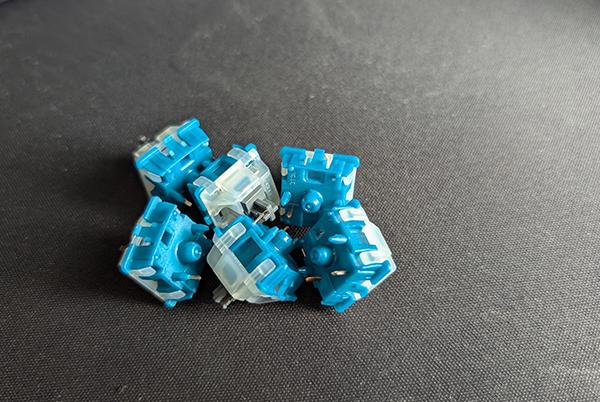 a group of blue and white plastic pieces sitting on top of a table