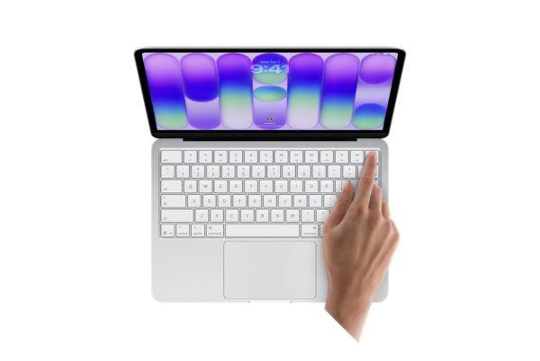 A hand demonstrating the Touch ID on MacBook Neo