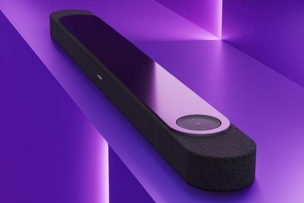 a Bose Lifestyle Ultra soundbar sitting on a purple shelf