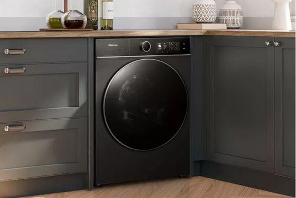 a Hisense KitchenFit 5i washing machine sitting in a kitchen with grey cabinets