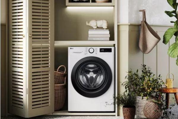 a laundry room with a LG Series 4 washing machine in it