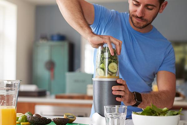 Man using a juicer