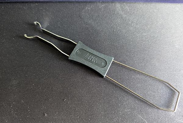 a pair of scissors sitting on top of a table with a table cloth