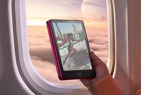 a person holding a tablet in front of an airplane window