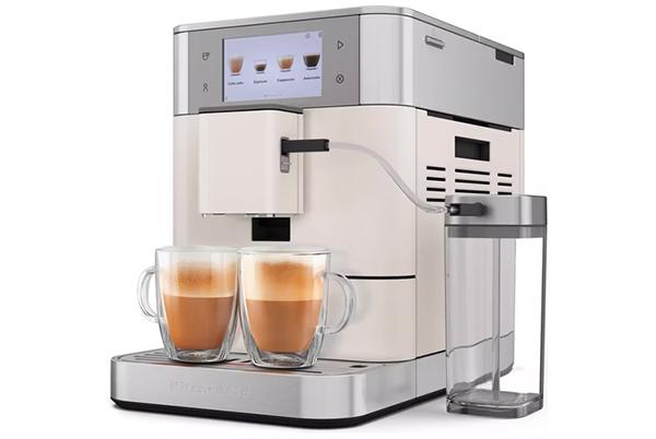 a coffee machine with two cups of coffee on top