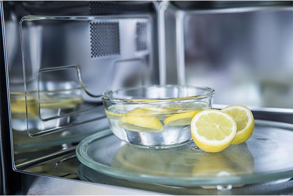 Clean a microwave with lemon
