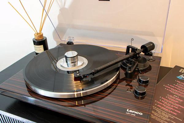 a record player with a record on it sitting on a table