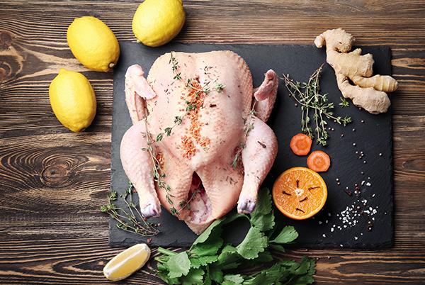 Herbs and seasoning on a chicken