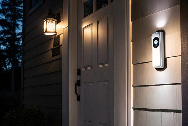 a door with a light on it and a light on the wall
