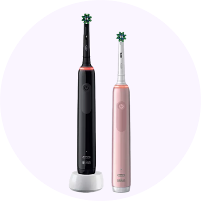 two electric toothbrushes are side by side on a white background
