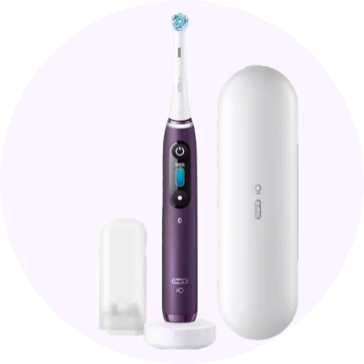 a purple electric toothbrush with a white case and a white toothbrush