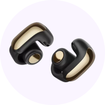 A pair of open ear headphones on a light purple circle