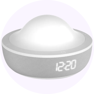 a clock with a white face sitting on top of a white circle
