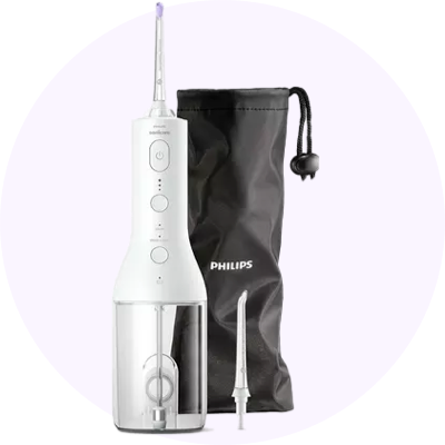a white and black electric water flosser with a pouch and a bag