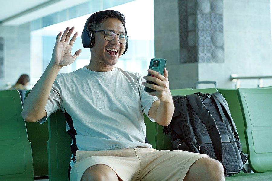 A man on a video call wearing headphones