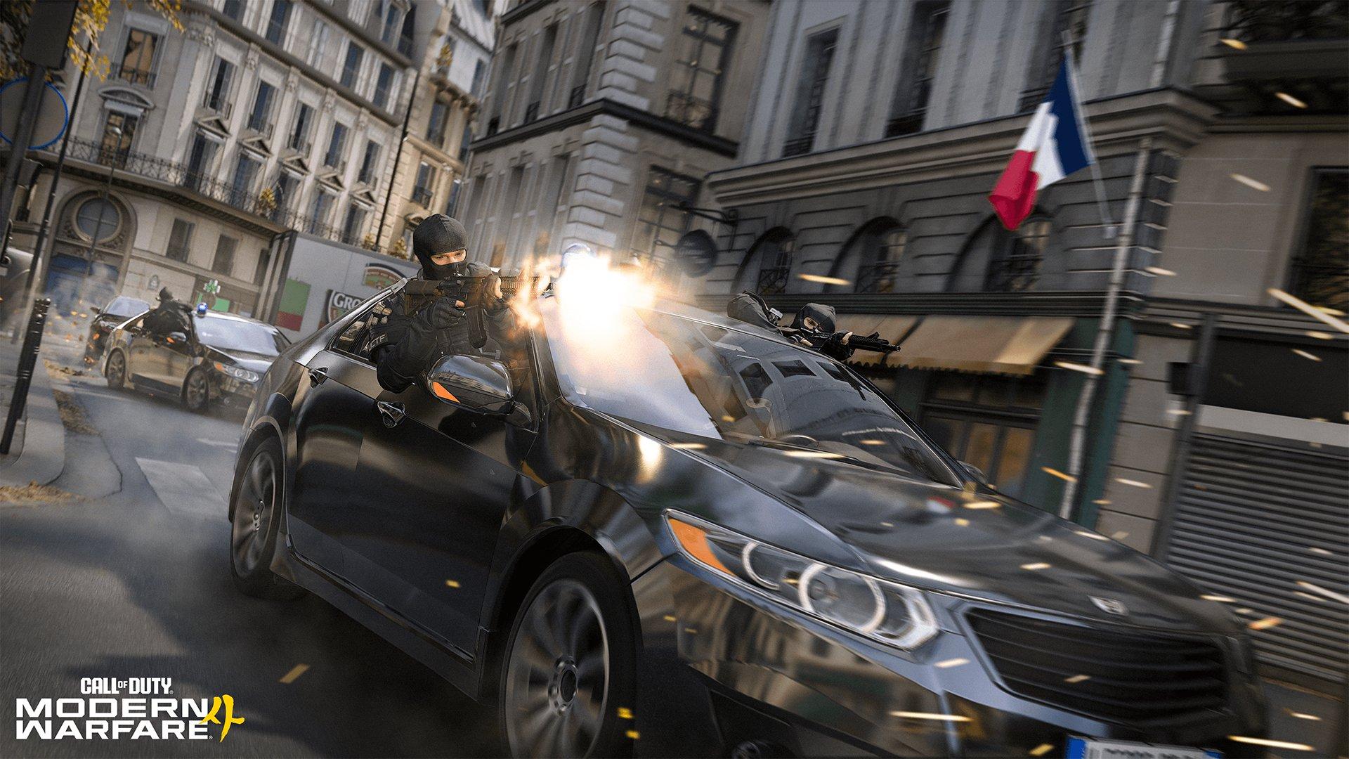 Two masked people are firing guns out of car that's driving through a city
