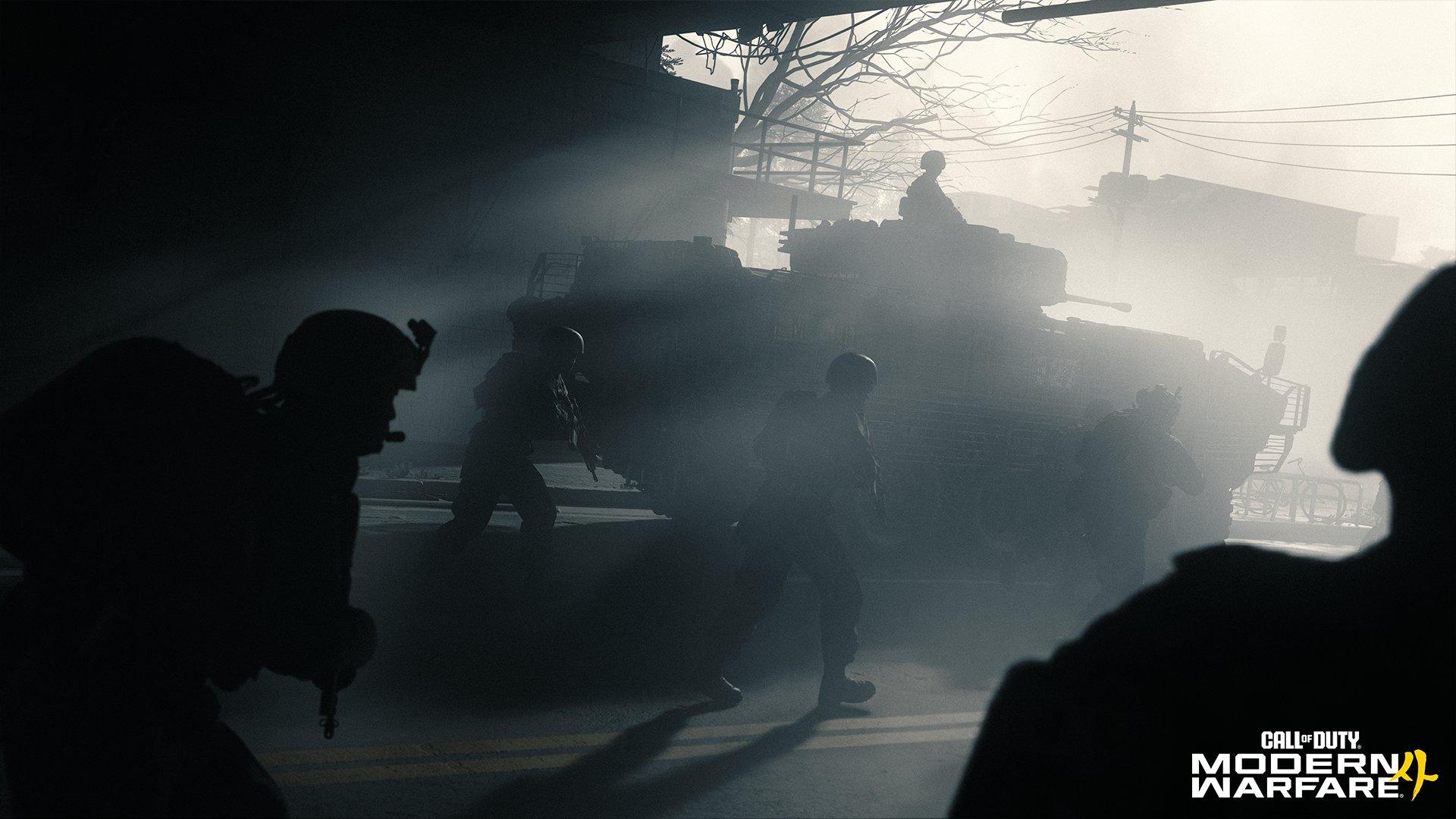 A group of soldiers is walking through a misty city landscape surrounding a tank