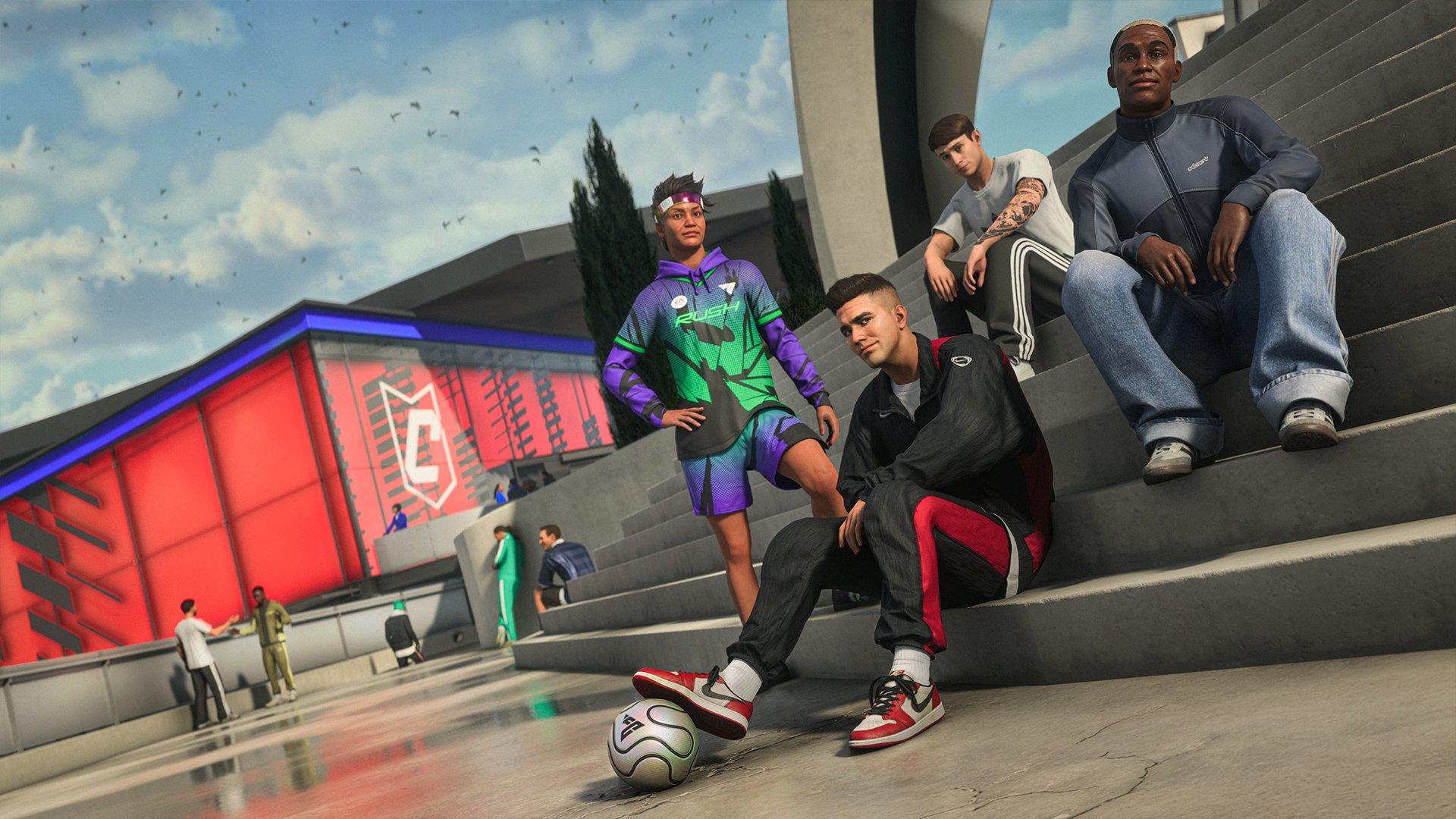 Four people are gathered on some outdoor steps, one has a football under their foot