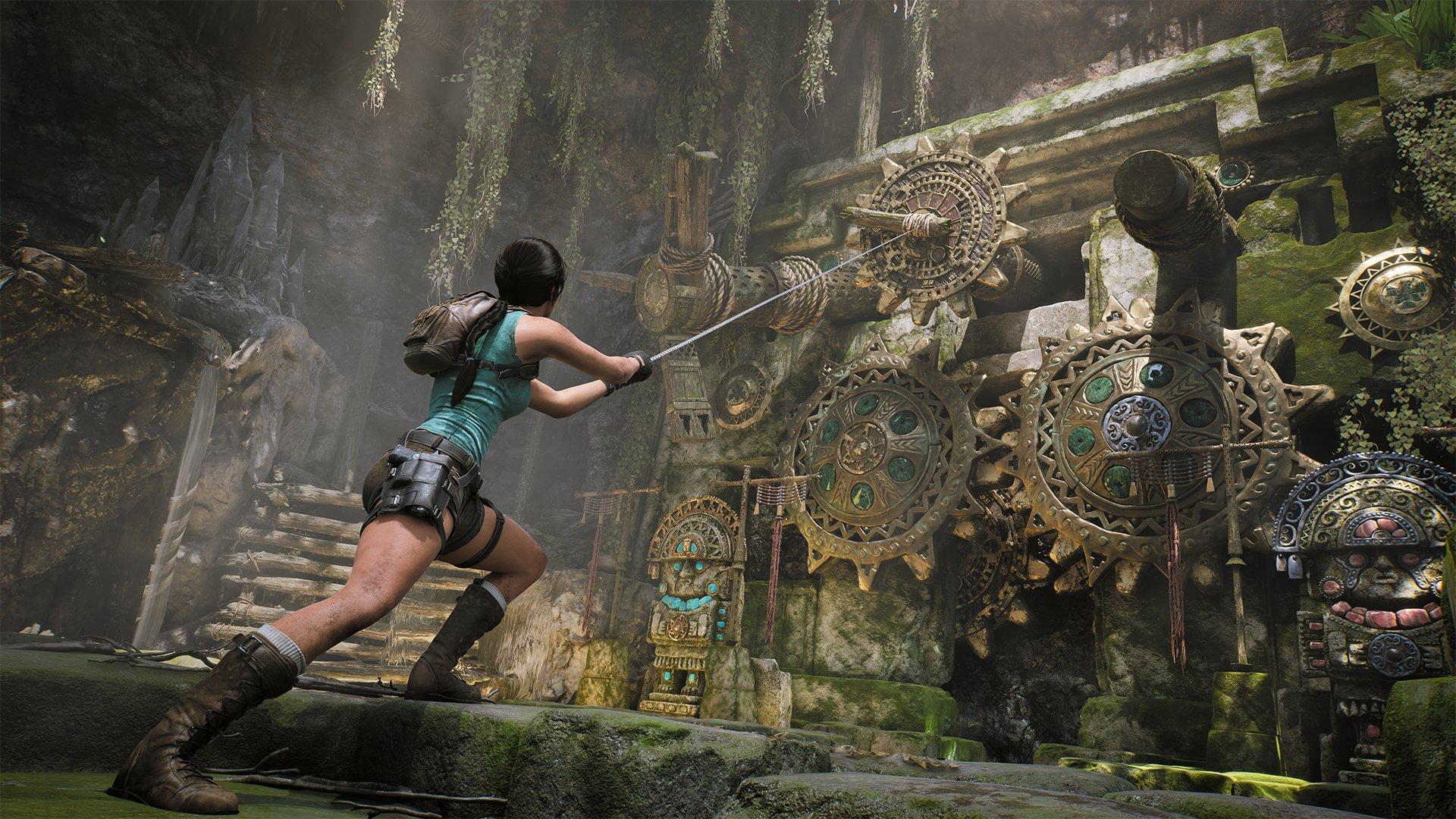 A woman holds a rope that is attached to a large cog on a wall of golden cogs