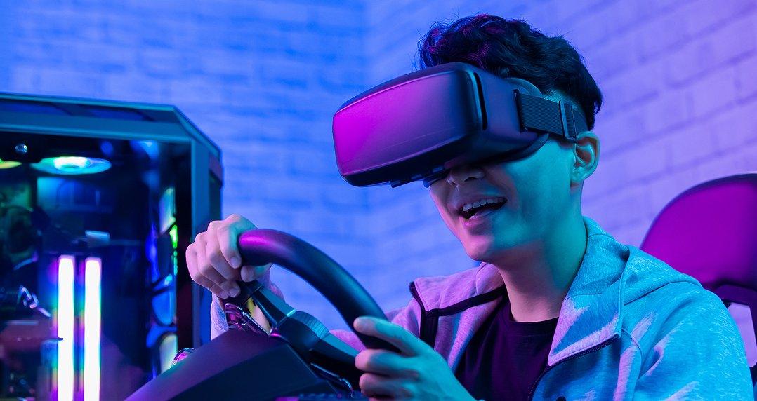 a man wearing a headset and holding two controllers