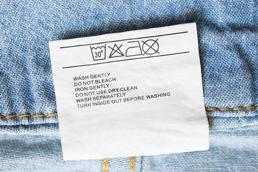 Close up of a washing label in a pair of jeans