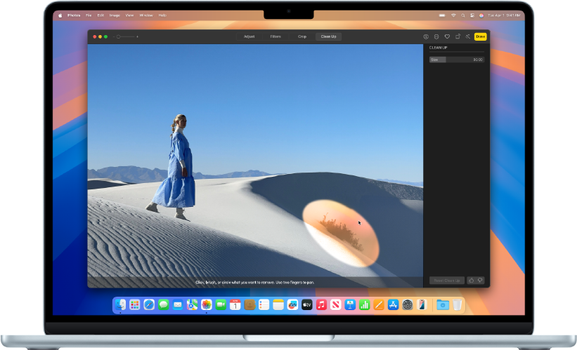 a MacBook with a photo on the screen