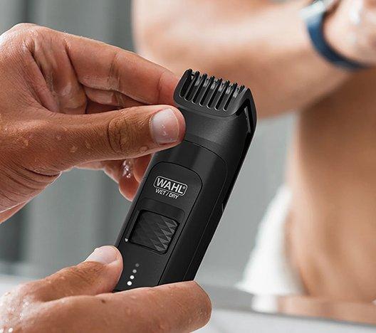 person using a Wahl manscaper