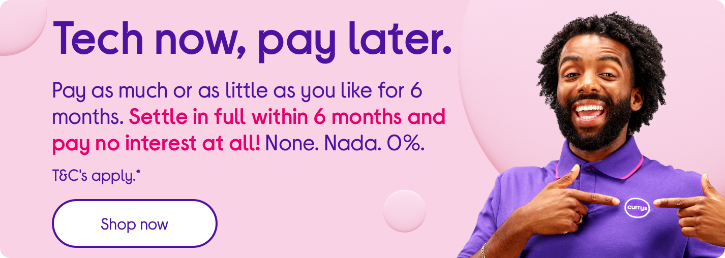 a man is smiling and pointing at a phone with a purple background