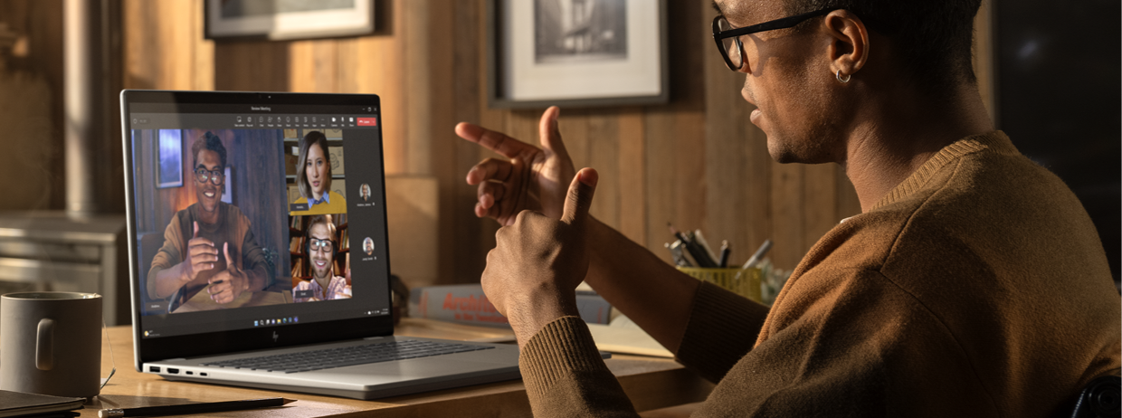 A man talking on a video call on a laptop