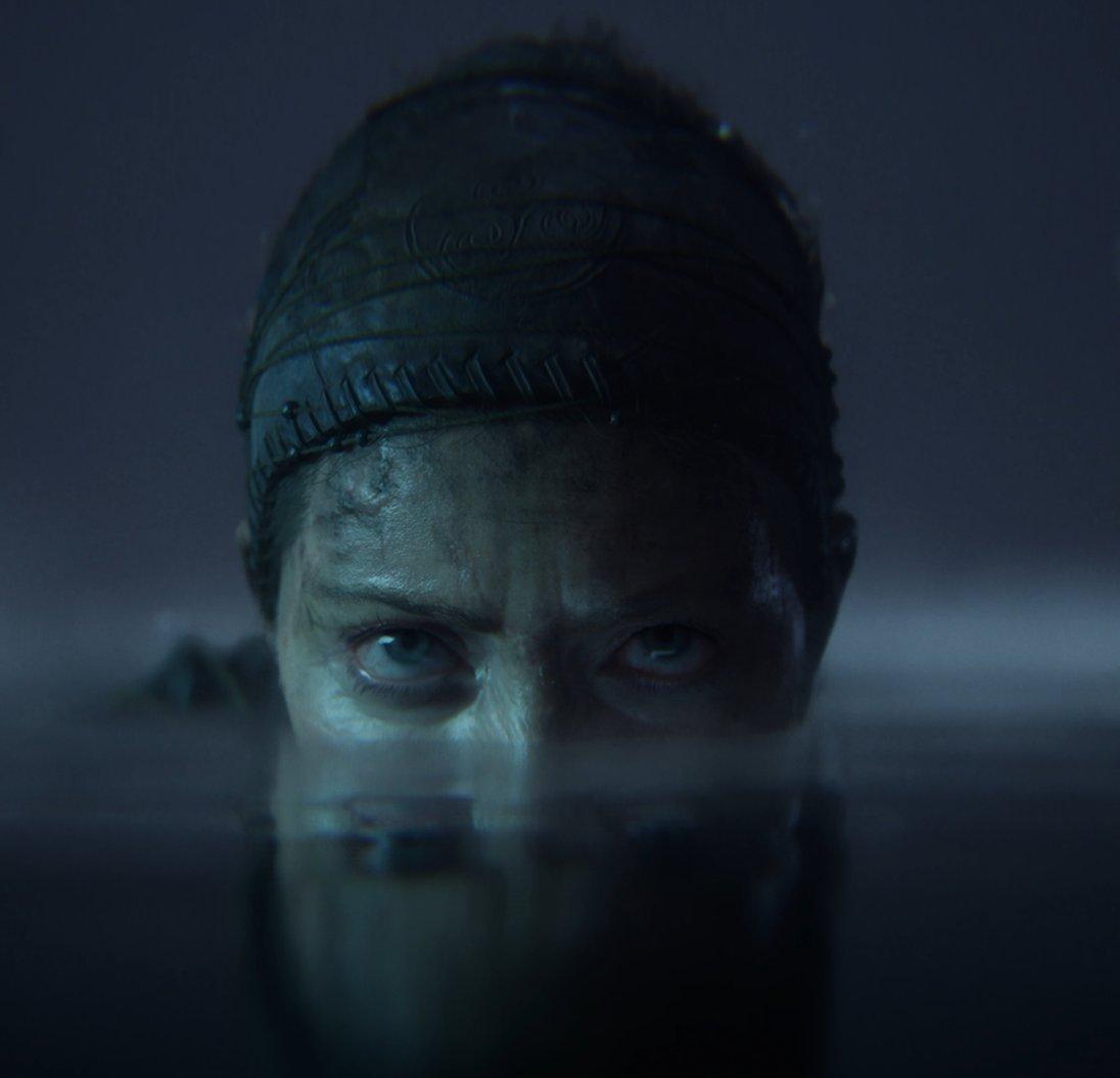 A person in water with just the top of their head showing